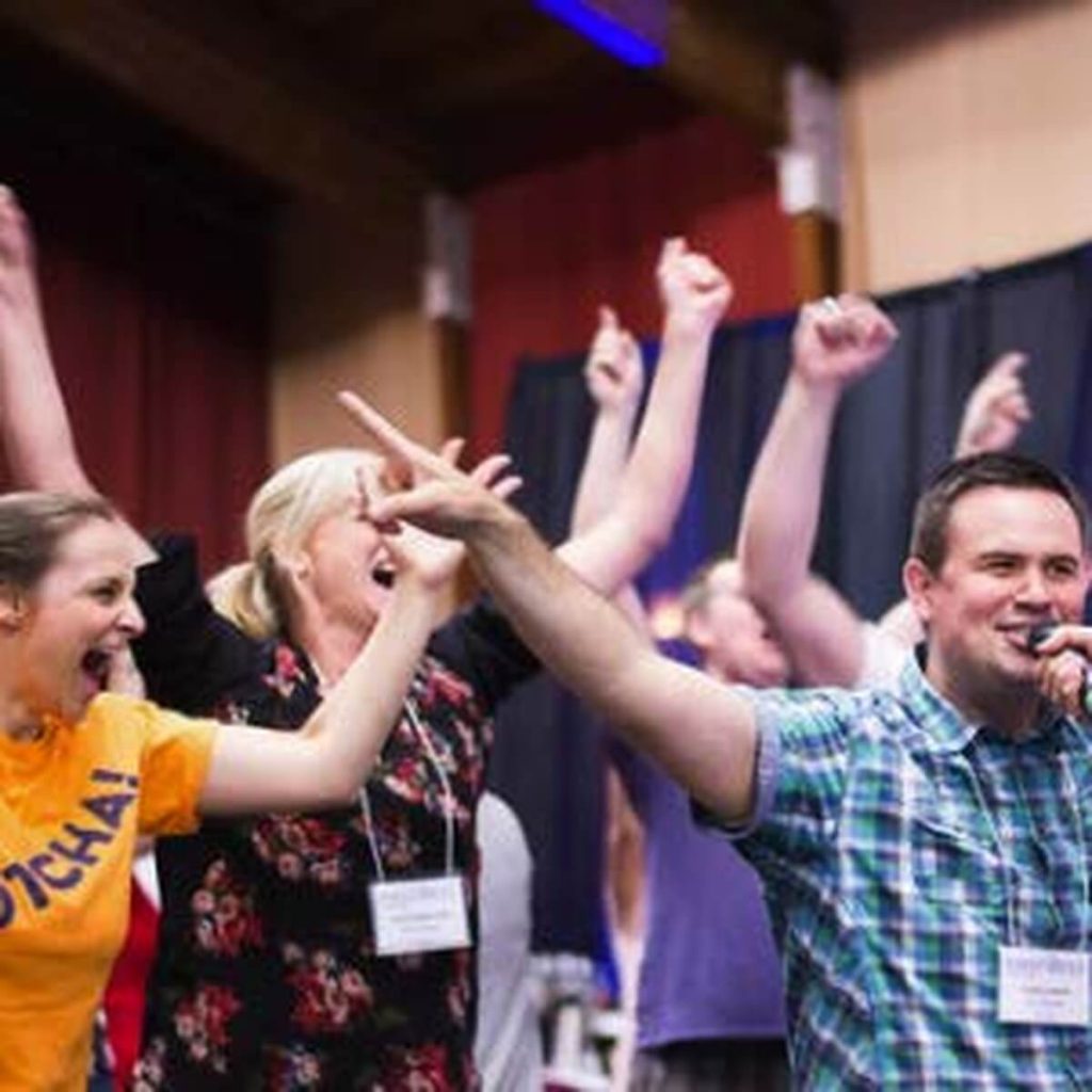 name-that-tune-team-building-music-trivia-corporate-event-crowd-standing-cheering