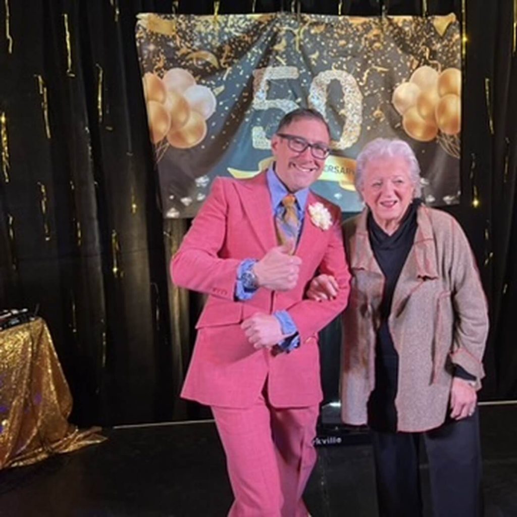 name-that-tune-music-trivia-corporate-event-stage-pose