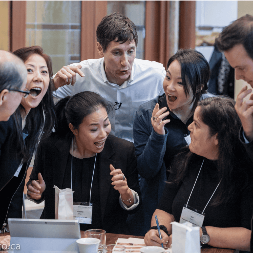 Facilitation-happy-laughing-engaged-group-corporate team building, keynote speakers and emcees, Vancouver