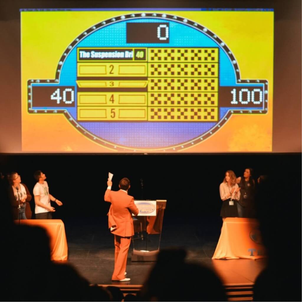 Family Feud stage moment — teams competing