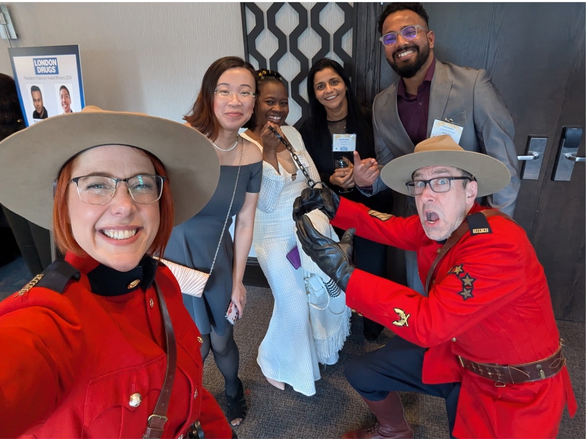 Engagement Unlimited roving Mounties performers in RCMP uniform engaging corporate event guests in hotel hallway