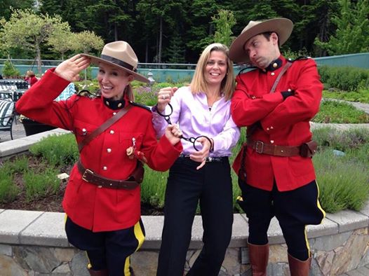 Roving Mounties greeting guests with handcuffs at a corporate reception