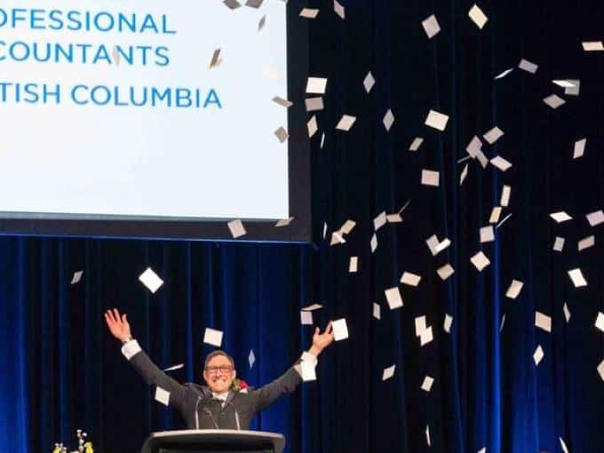 Emcee tossing confetti mid-celebration