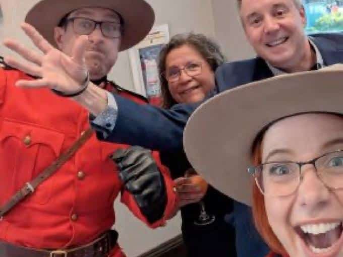 Comedic Mounties posing with event attendees