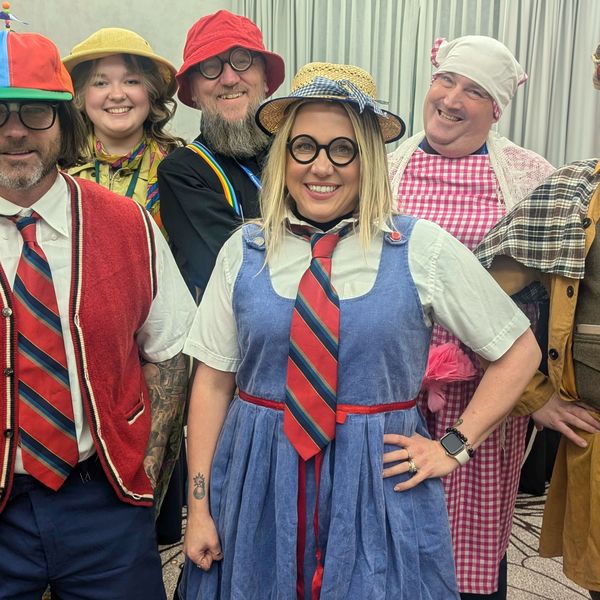Costumed suspects mid-investigation during a corporate murder mystery Vancouver event