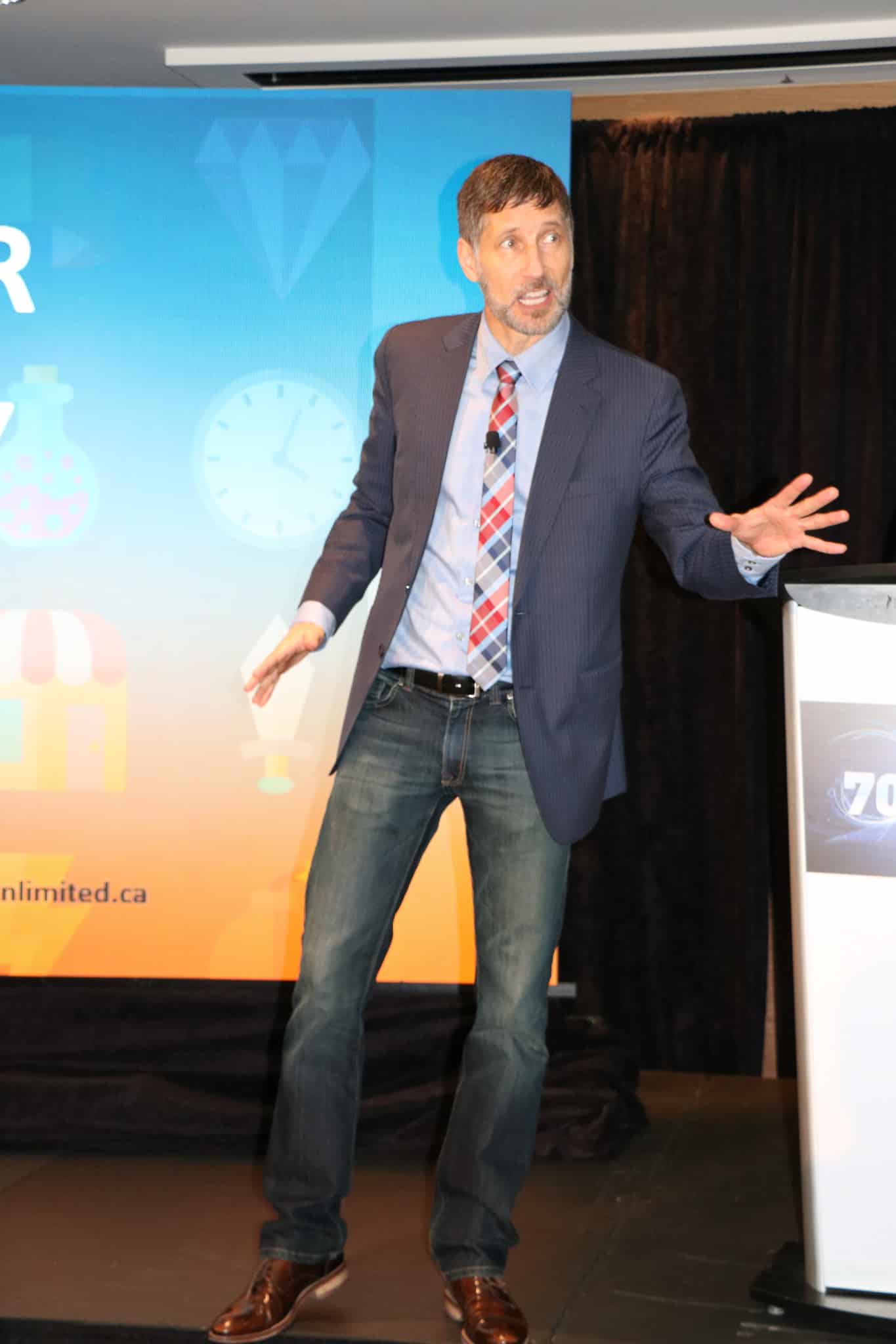Roger delivers a keynote to a corporate audience