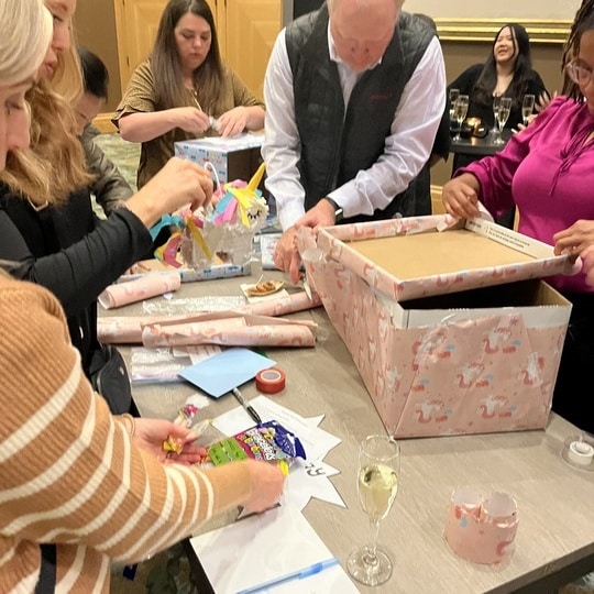 A close-up of an employee assembling a Birthday Box