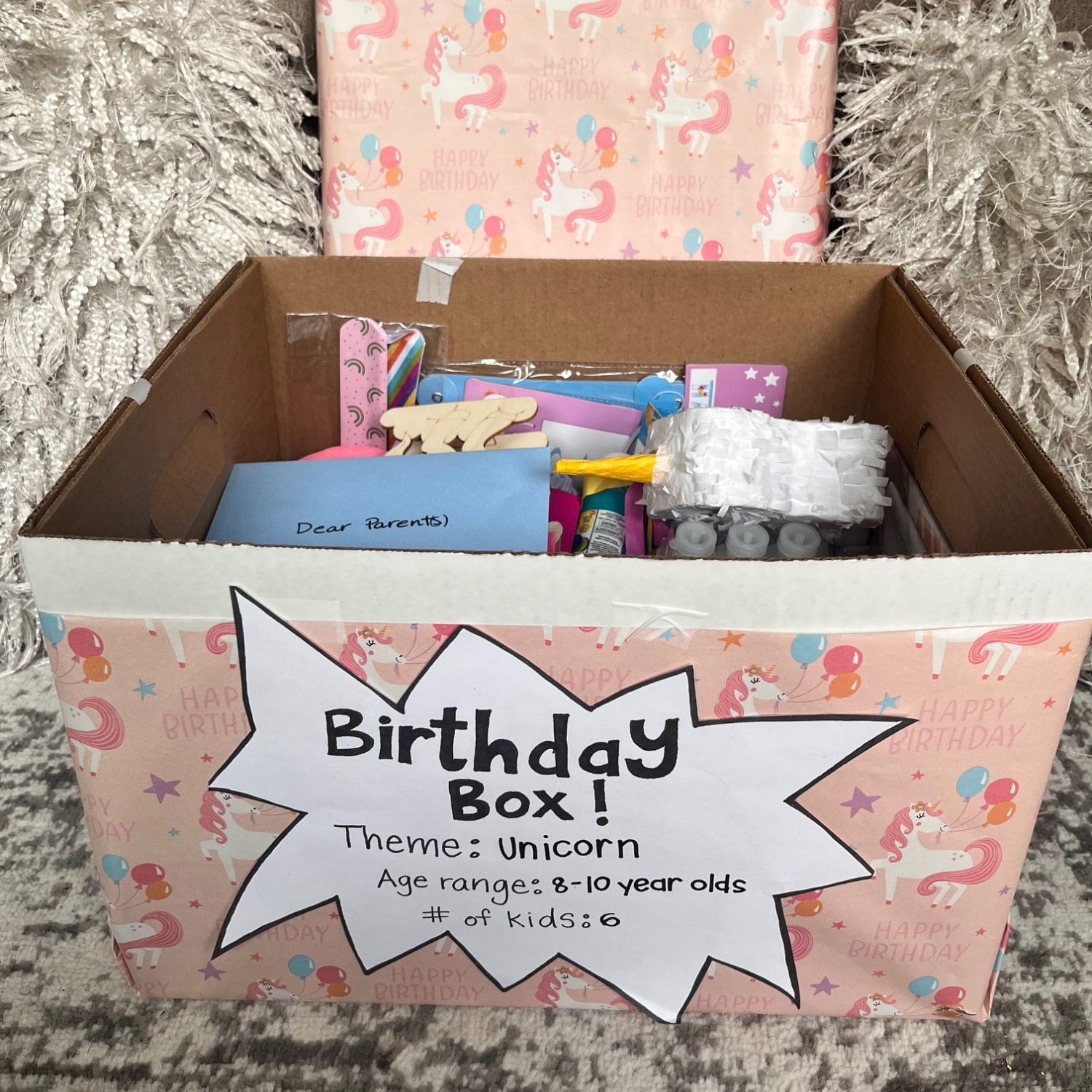 An opened Birthday Box showing its contents