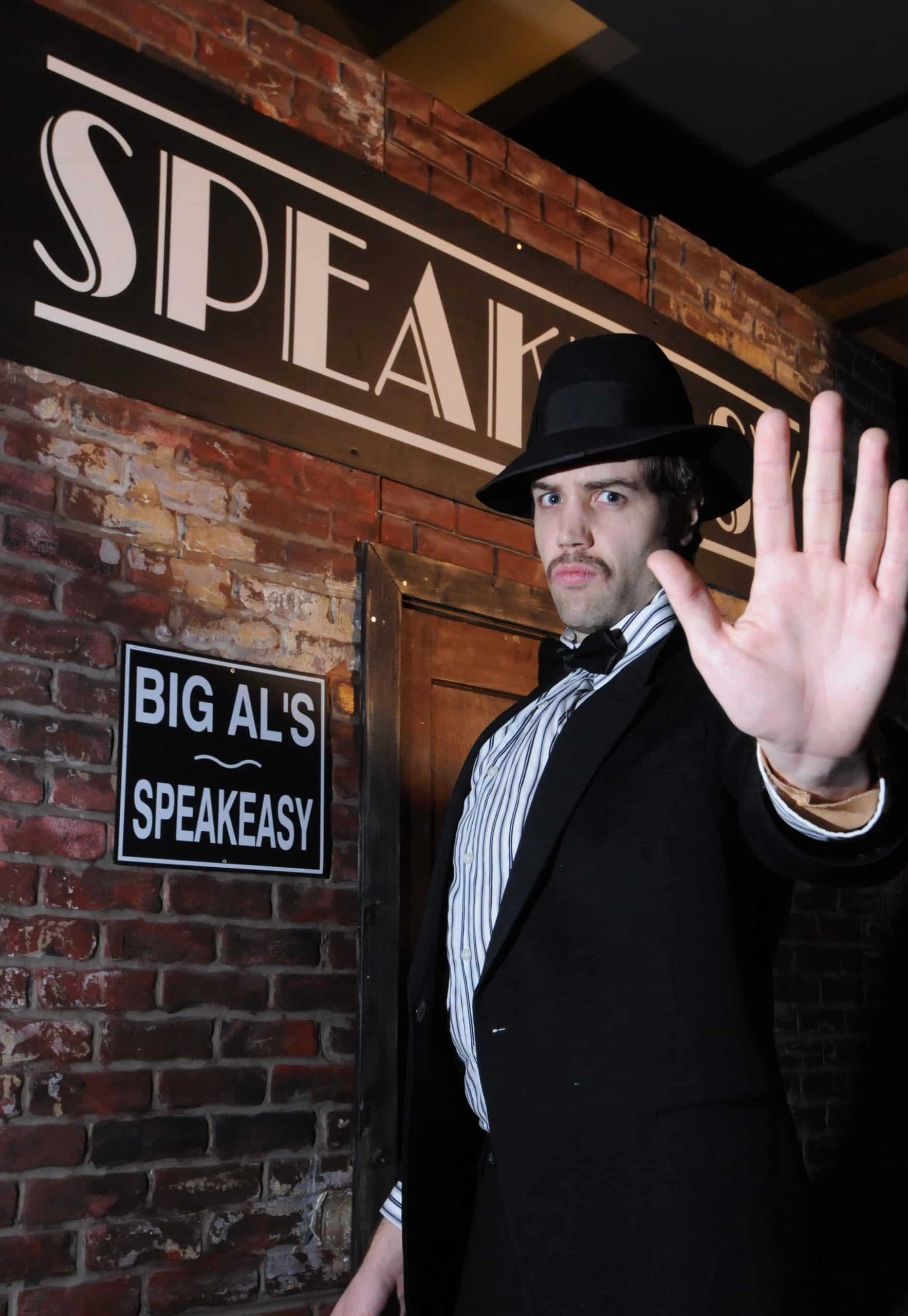 A costumed nightclub 'bouncer' character greets guests