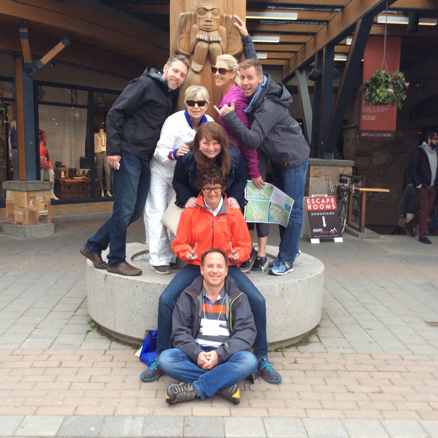 A team stops at a totem pole landmark challenge