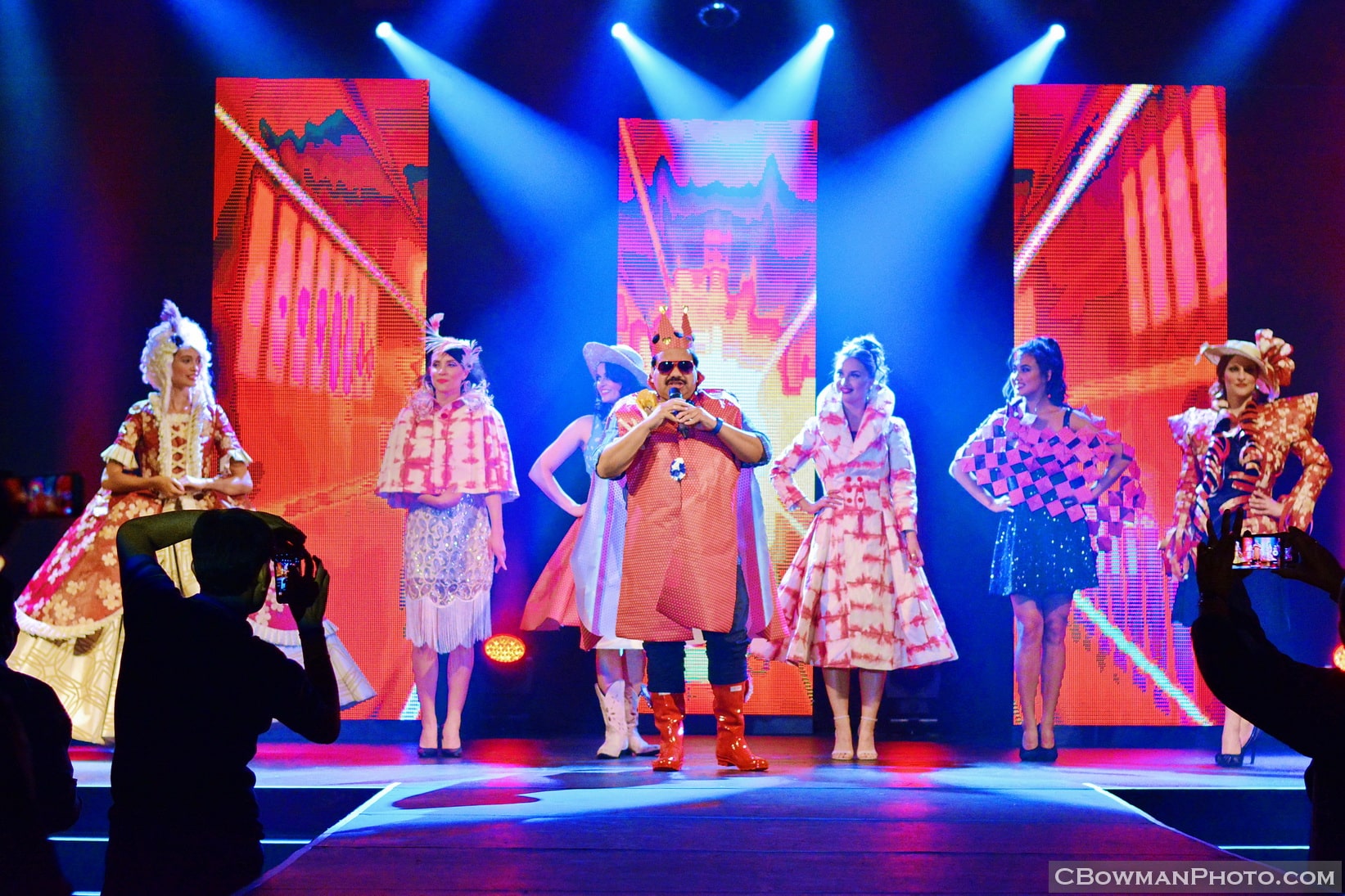 A custom fashion show staged for a corporate client, built around their own branded wallpaper — Engagement Unlimited themed live entertainment, Vancouver