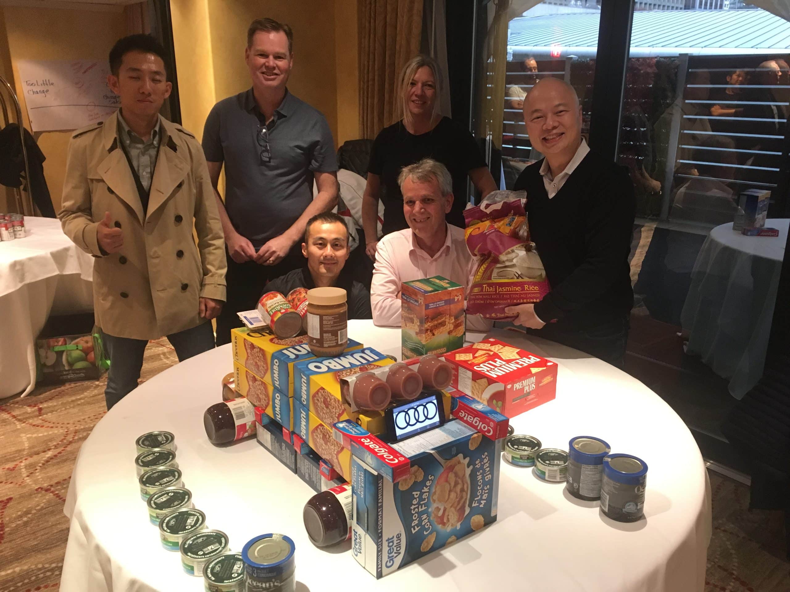 Employees pack food donations for Food for Families