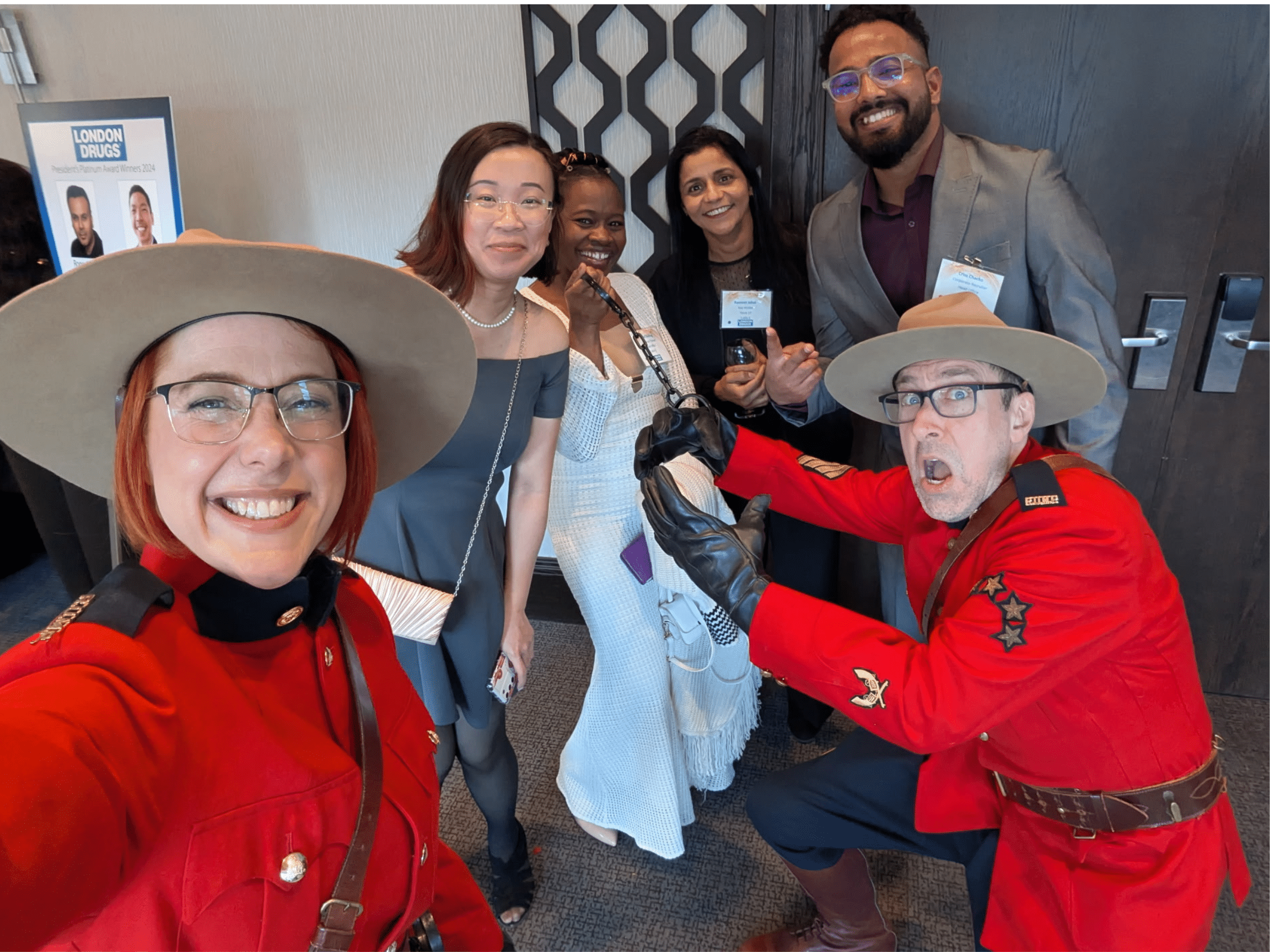 Costumed Mountie characters greet guests in the hallway, 2025