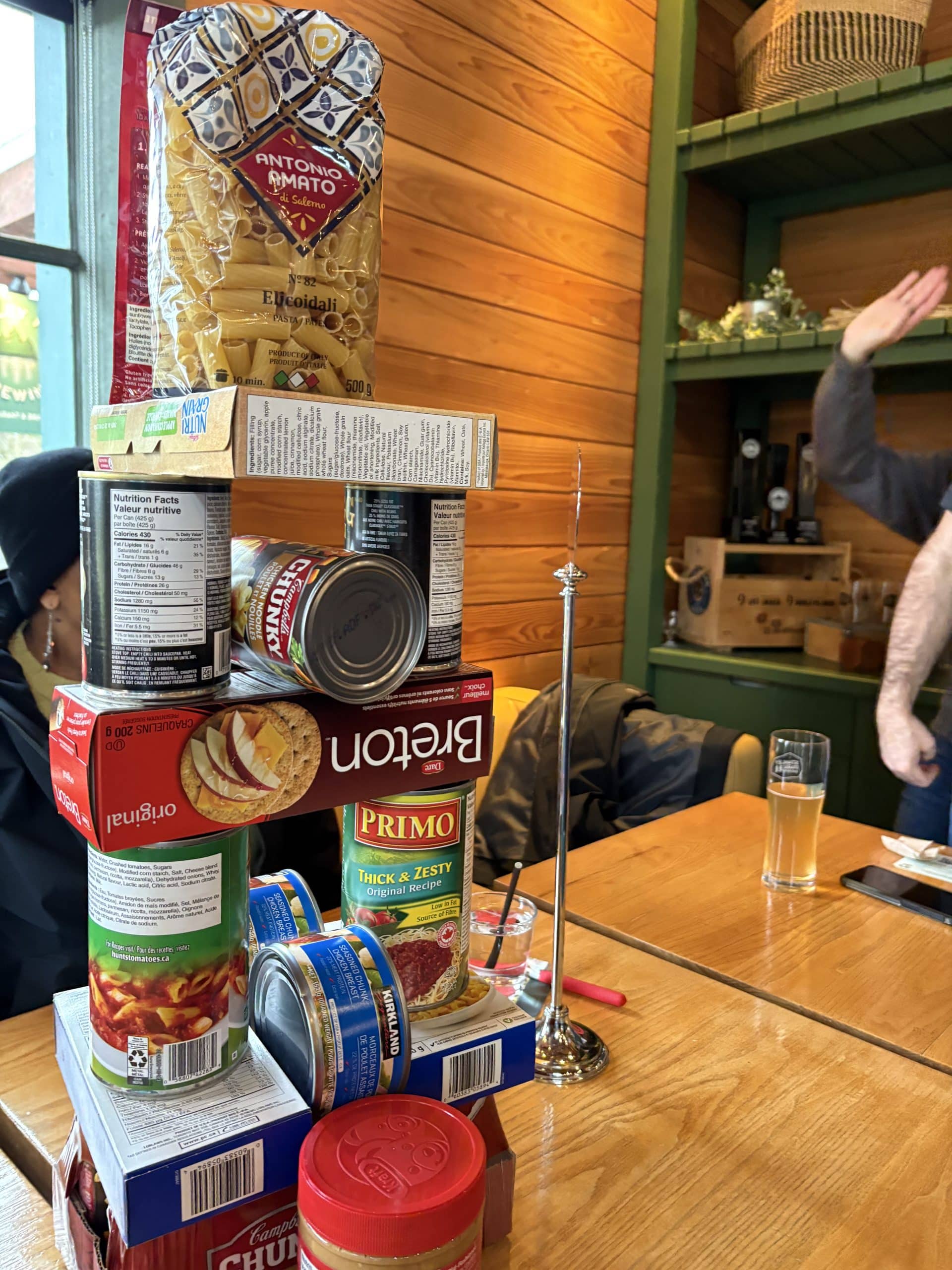 Employees assemble food packages for donation