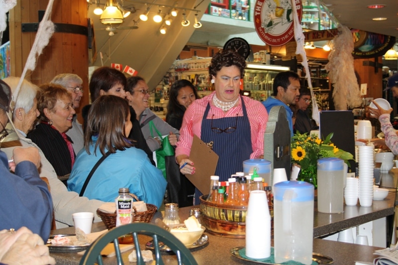 A 'Julia Child' themed roving character entertains guests