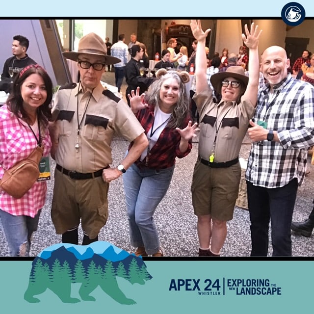 Costumed Park Ranger characters greeting guests at a corporate event