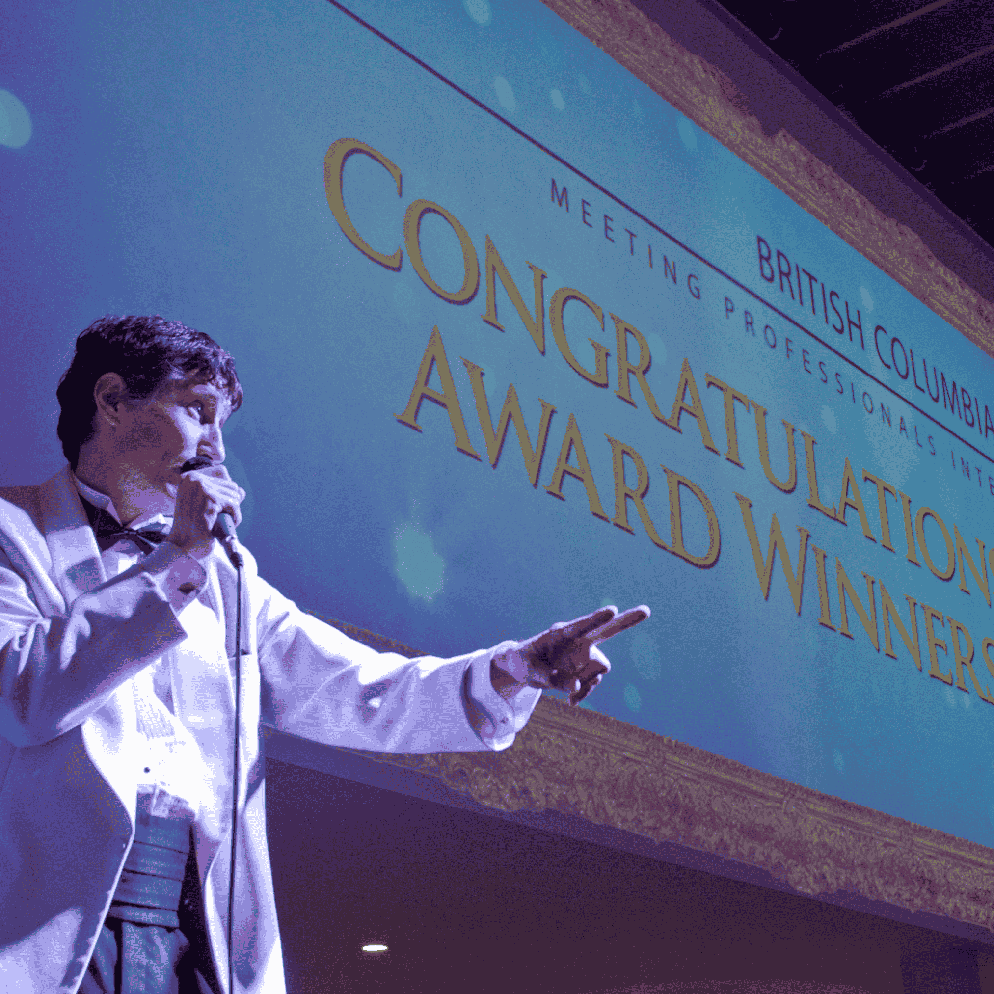 Roger hosts an awards presentation with the winners