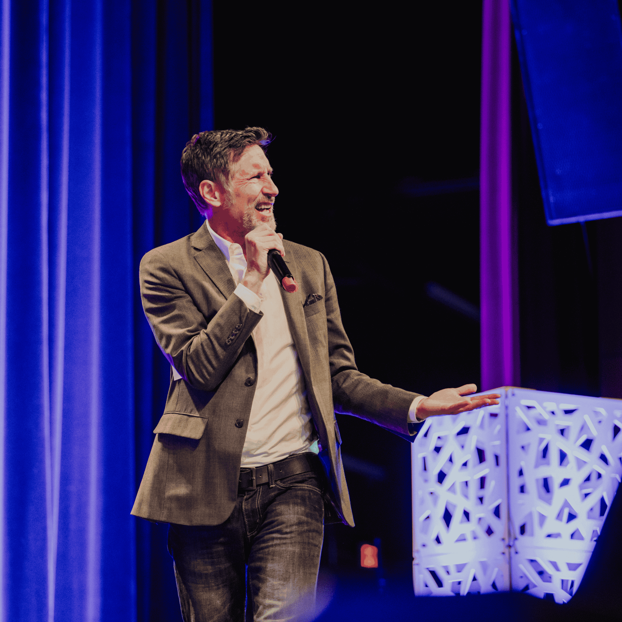 Roger emcees the BCAA event from center stage