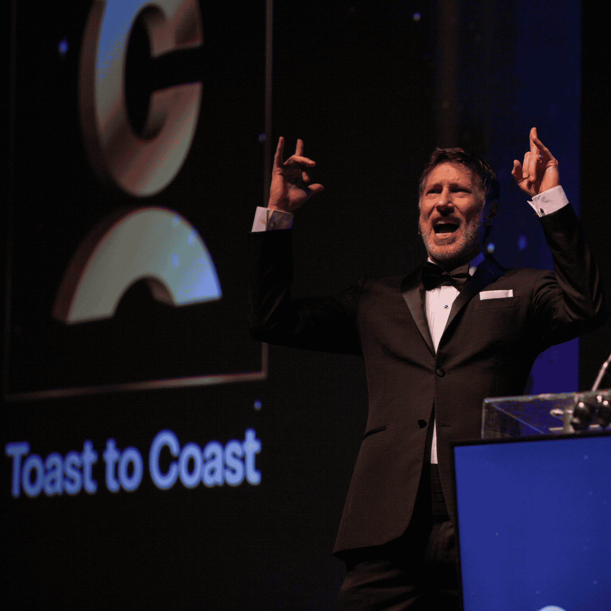 Roger emcees the Toast to Coast event