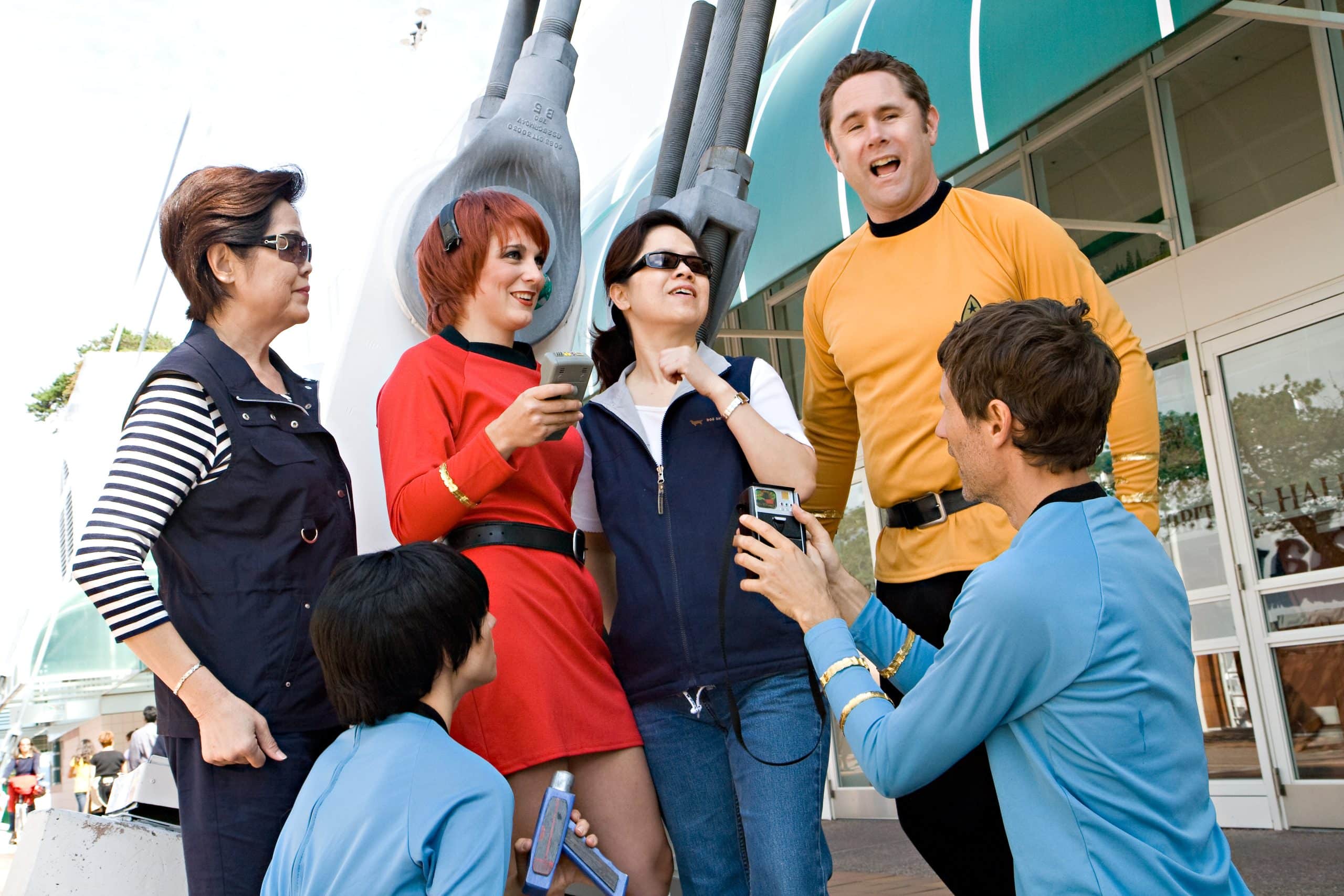 Star Trek costumed characters posing with guests