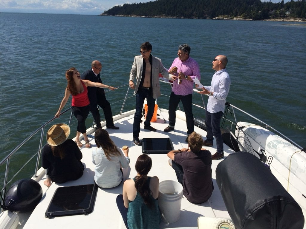 An undercover actor's cover breaks mid-scene aboard a charter boat, guests reacting in real time.
