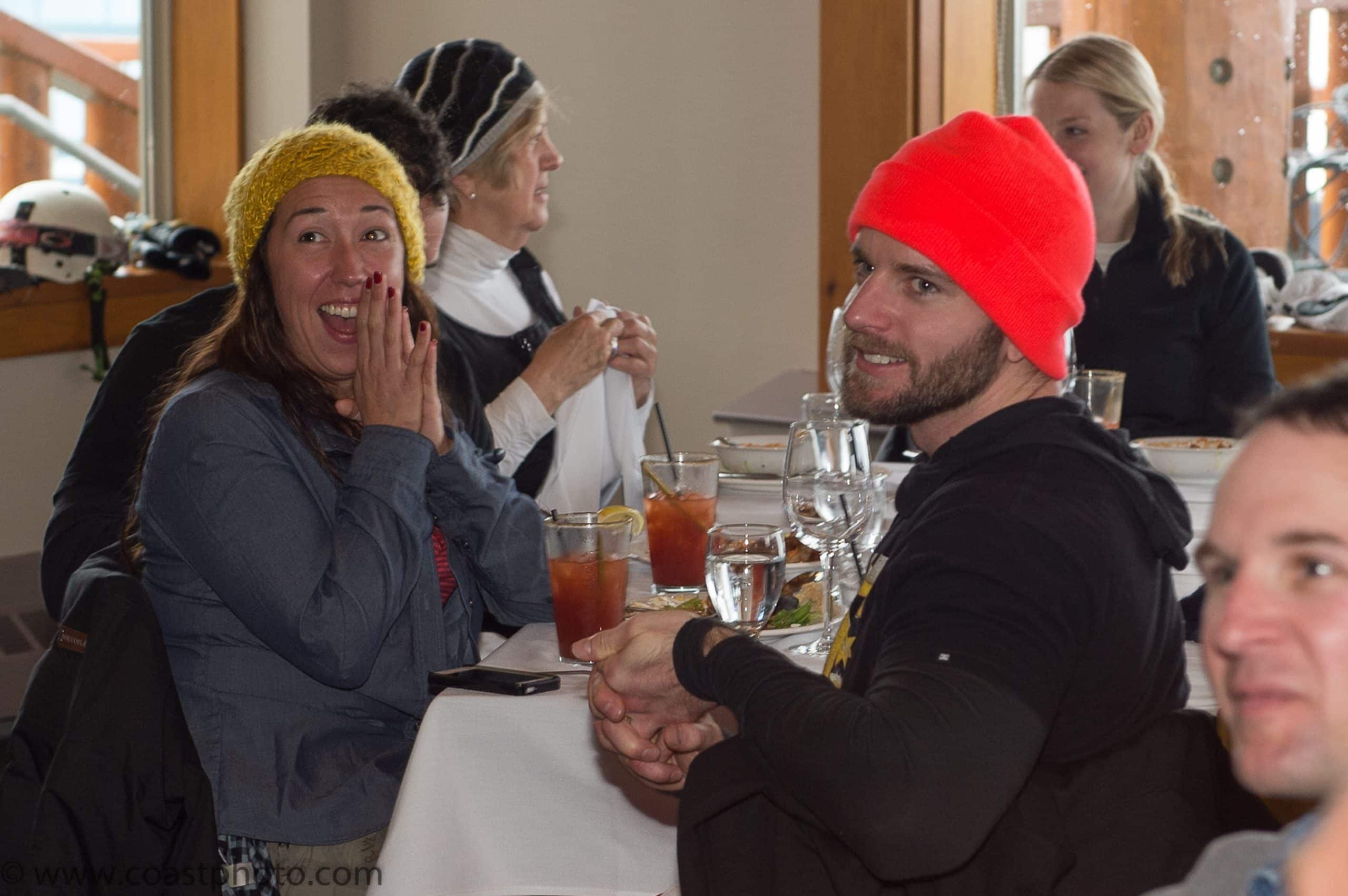 A guest covers her mouth in disbelief as Roger reveals he's been an actor undercover among the group the whole trip.