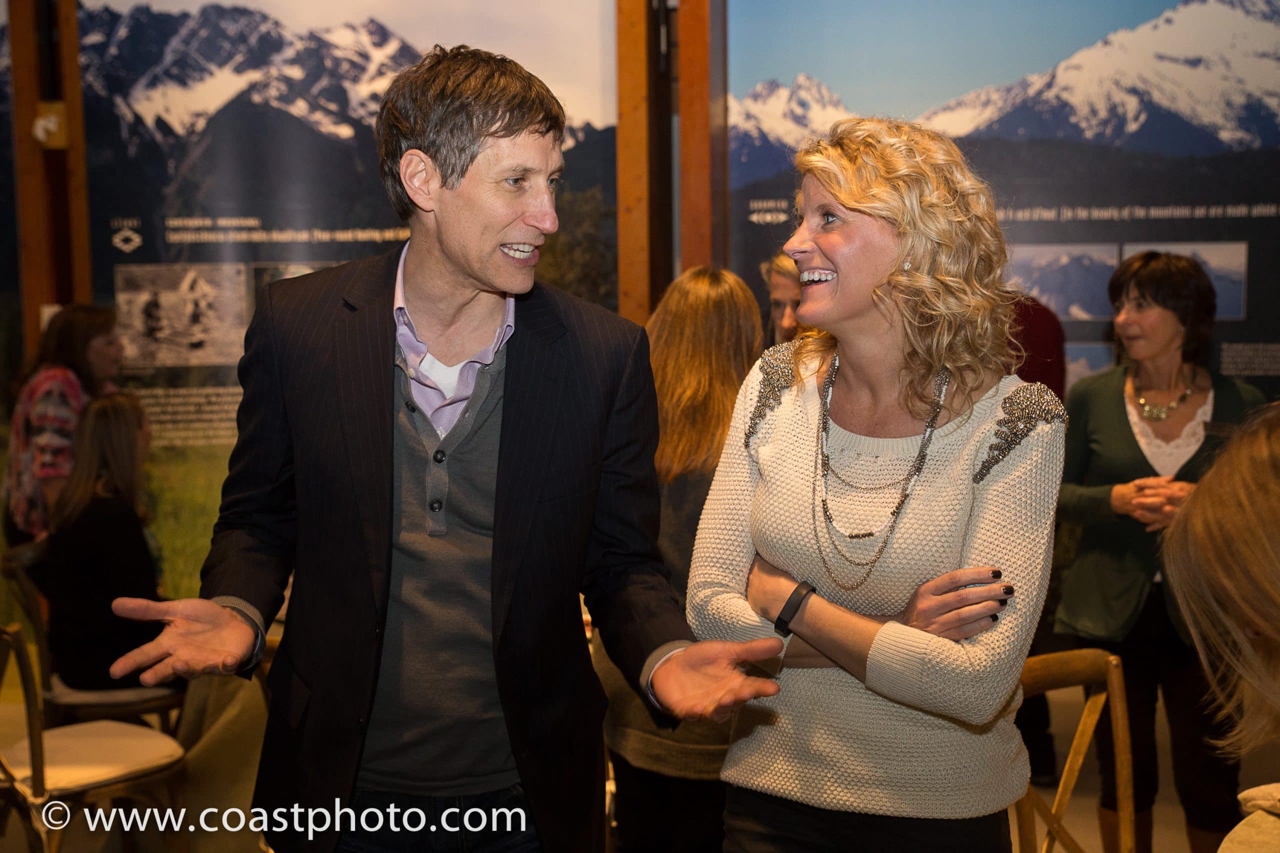An undercover guest blends into a small group during a Whistler Super FAM, nothing revealed yet — Engagement Unlimited Undercover Actors immersive events, Vancouver