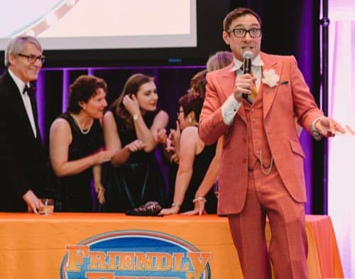 Stefano hosting Family Friendly Feud at a corporate holiday party