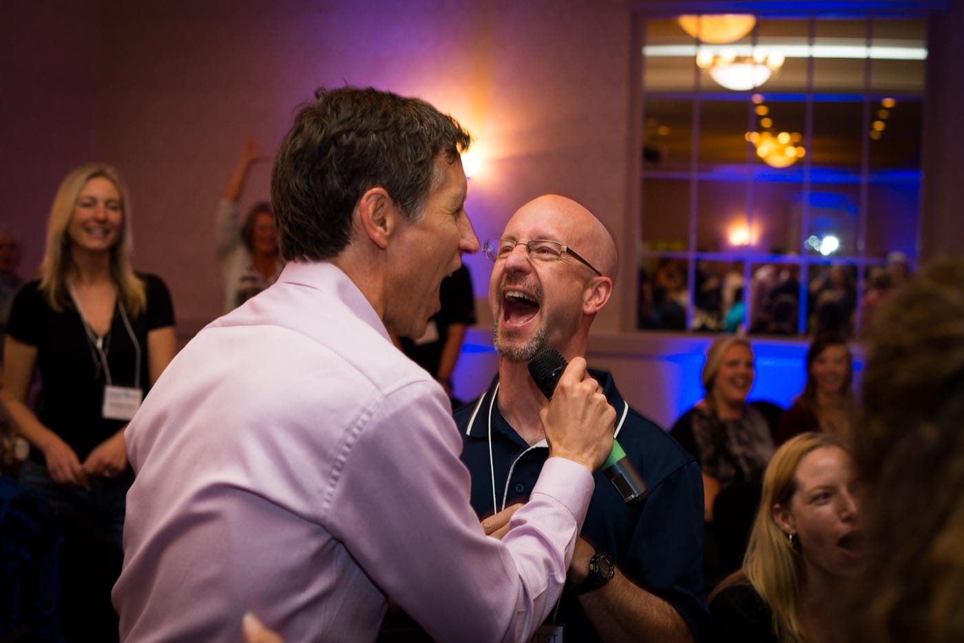 Engagement Unlimited event guests singing together, full audience participation